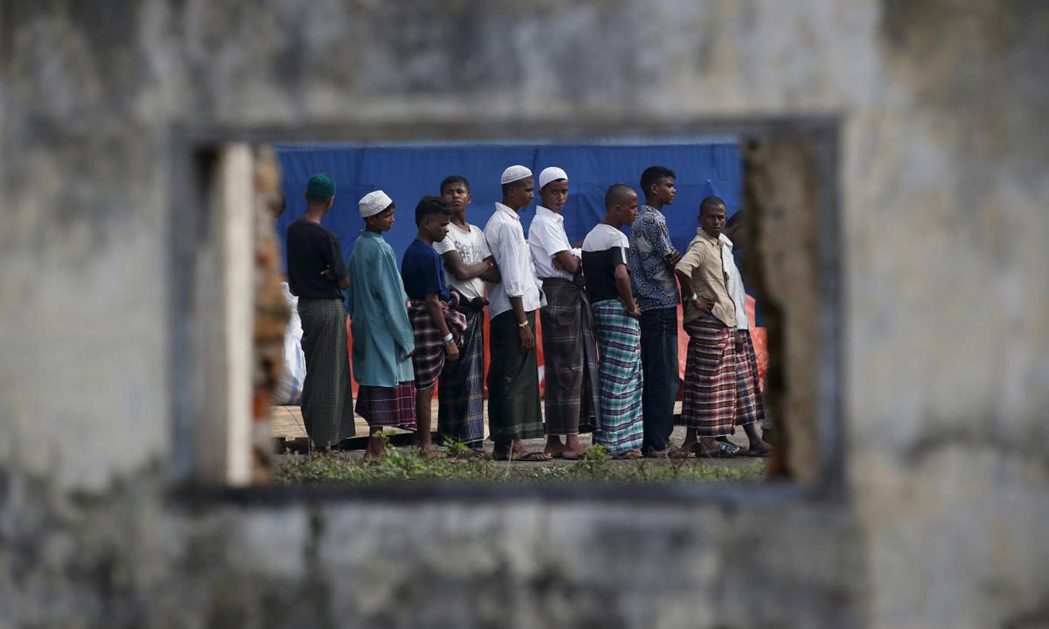 Rohingya immigrants at a confinement camp — Reuters