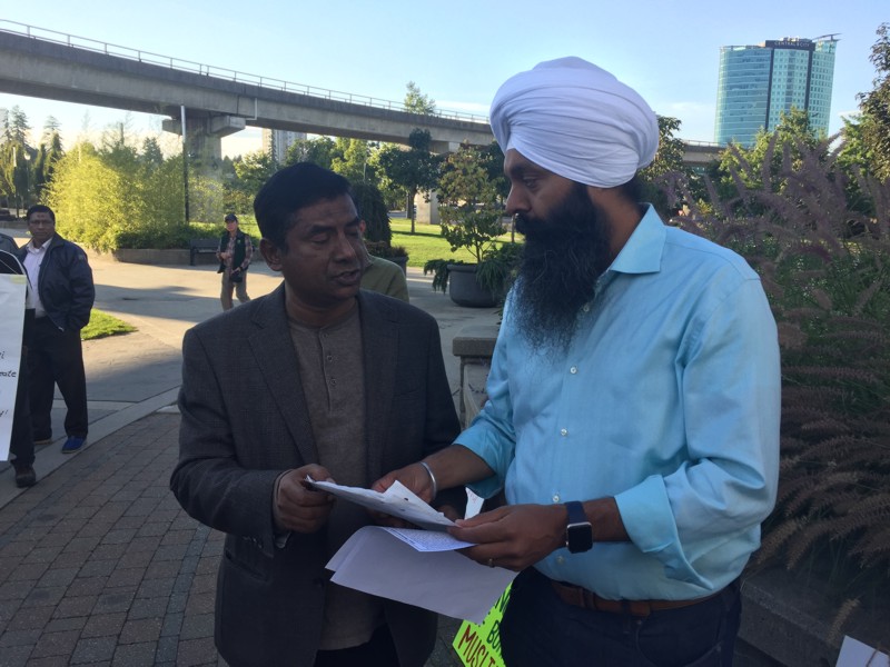 About 50 demonstrators showed up at a rally for Rohingya refugees at Surrey's Holland Park on Saturday evening