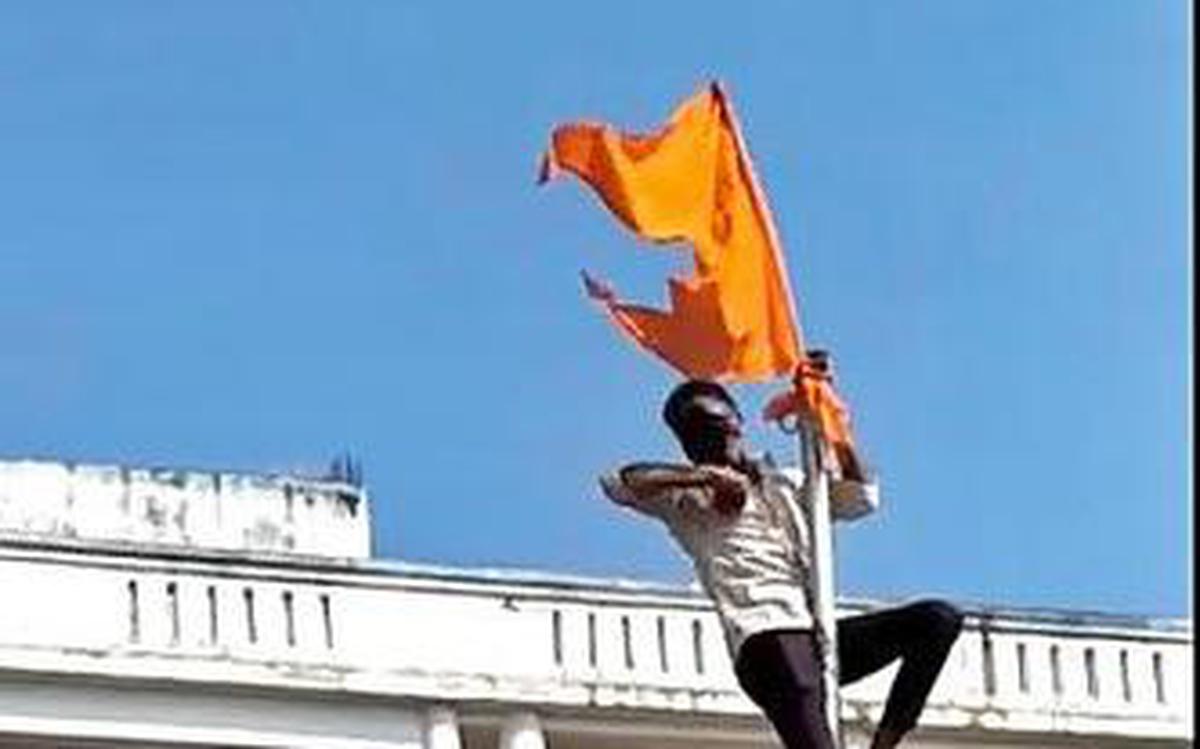 Hanuman Jayanti procession participants hoist flag on Gujarat dargah 